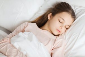 girl sleeping in bed